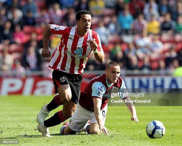 Martin Paterson of Burnley is challenged by Kirean Richardson of Sunderland during the Barclays Premier League match between Sunderland and Burnley...
