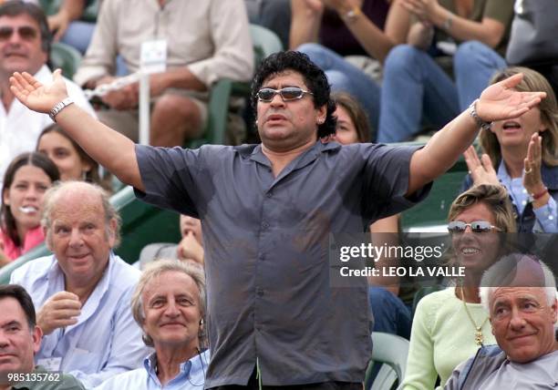 The argentinian star soccer player, Diego Armando Maradona, is seen reacting during the tennis game of friend Gastón Gaudio, who won 6-3, 6-4, and...