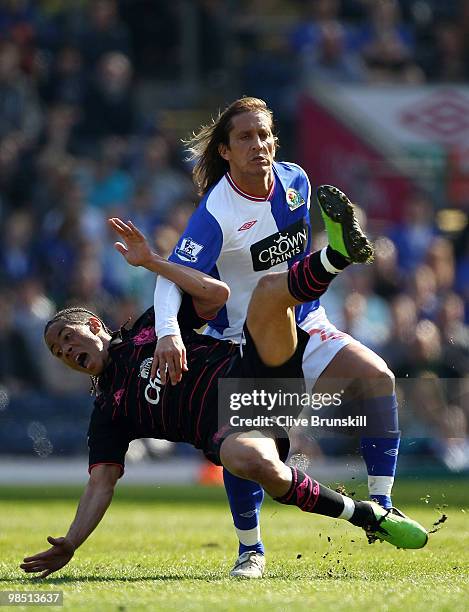 Steven Pienaar of Everton clashes with Michael Salgado of Blackburn Rovers during the Barclays Premier League match between Blackburn Rovers and...