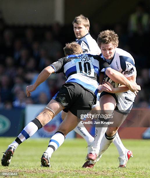 Jonny Kennedy of Sale is tackled by Butch James of Bath during the Guinness Premiership match between Bath and Sale Sharks at the Recreation Ground...