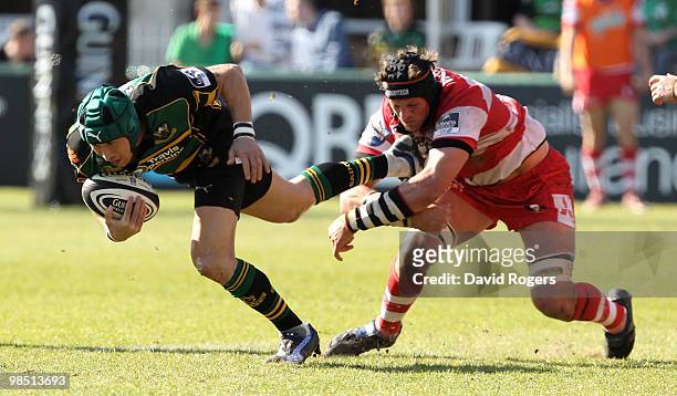 Bruce Reihana of Northampton is held by Alex Brown during the Guinness Premiership match between Northampton Saints and Gloucester at Franklin's...
