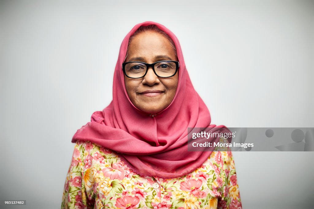 Portrait of smiling senior woman wearing hijab