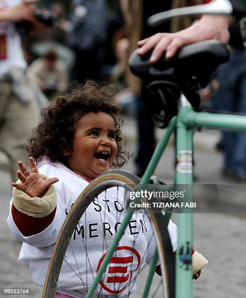 Child wears a tee-shirt reading Emergency during a demonstration in support of Italian medical charity Emergency employeesheld in Afghanistan over an...