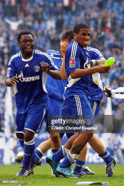 Gerald Asamoah and Jefferson Farfan of Schalke celebrate the 3-1 victory after the Bundesliga match between FC Schalke 04 and Borussia...