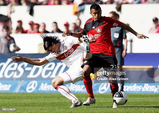 Sami Khedira of Stuttgart is challenged by Arturo Vidal of Leverkusen during the Bundesliga match between VfB Stuttgart and Bayer Leverkusen at the...