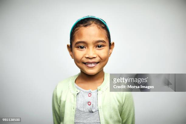 portrait of cute girl smiling on white background - östasiatiskt ursprung bildbanksfoton och bilder