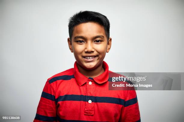 portrait of cute boy smiling on white background - kid face portrait stock pictures, royalty-free photos & images