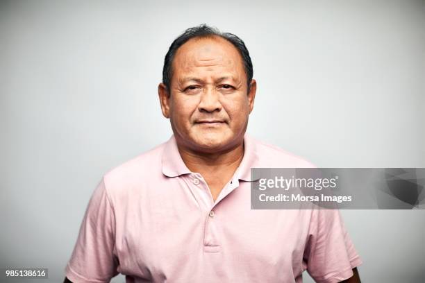 portrait of serious senior man on white background - serio foto e immagini stock