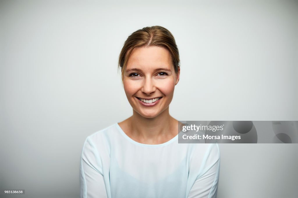 Portrait of mid adult businesswoman smiling