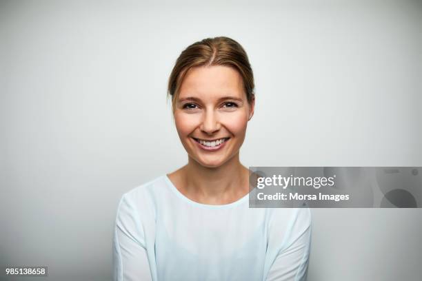 portrait of mid adult businesswoman smiling - happy businesswoman white background bildbanksfoton och bilder