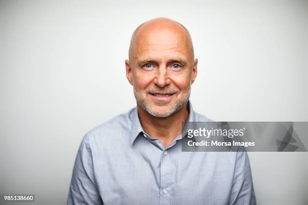 portrait of senior businessman smiling - hårbortfall bildbanksfoton och bilder