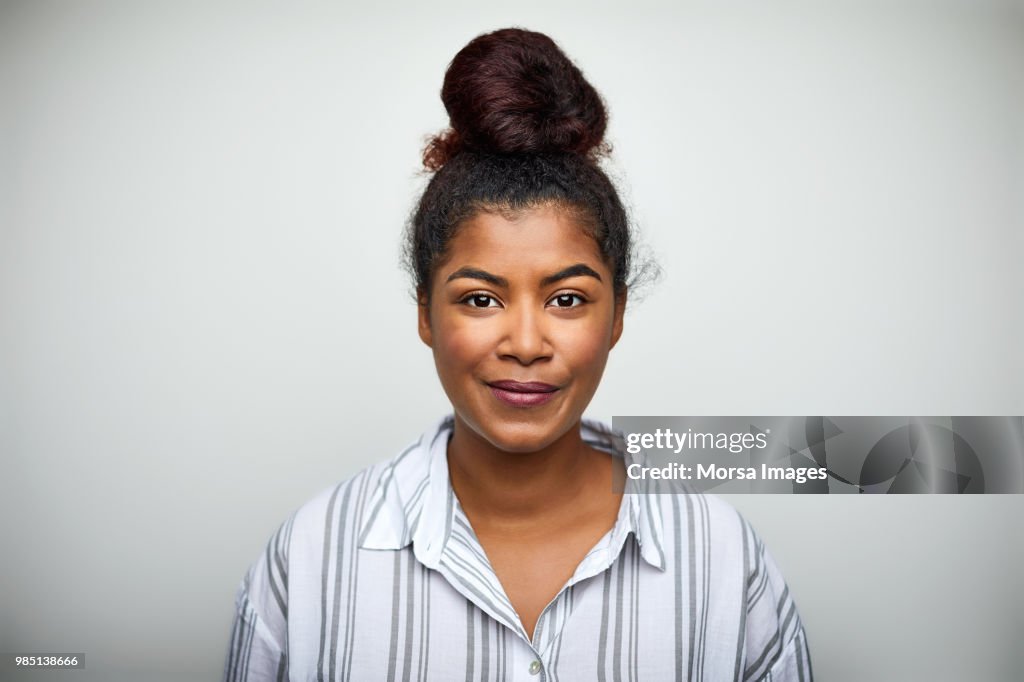 Businesswoman smiling over white background