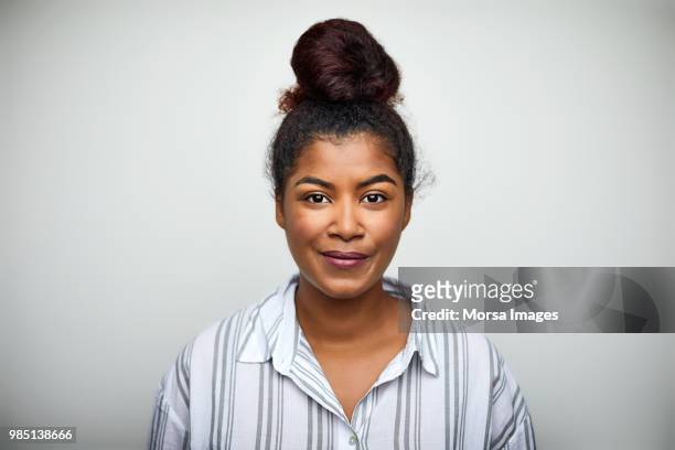 businesswoman smiling over white background - gente comune foto e immagini stock