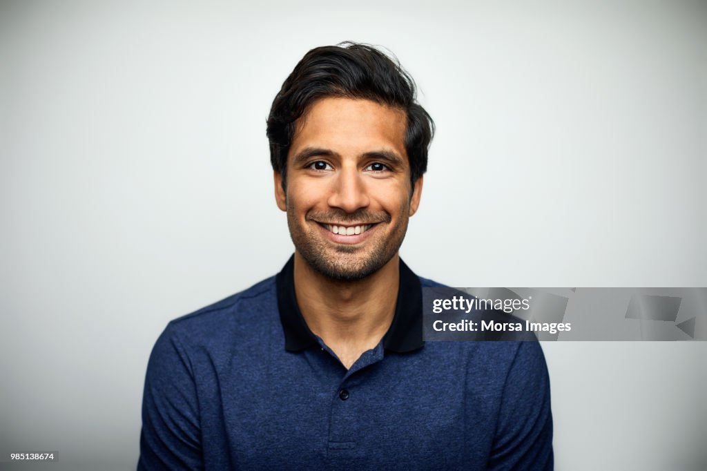 Portrait of smiling mid adult man wearing t-shirt