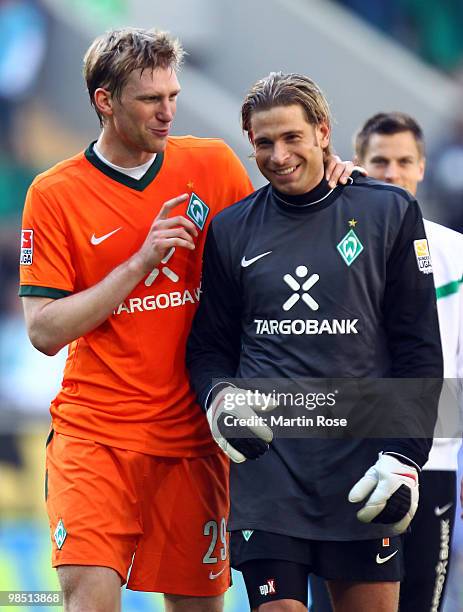 Per Mertesacker of Bremen jokes with team mate goalkeeper Tim Wiese after the Bundesliga match between VfL Wolfsburg and SV Werder Bremen at the...