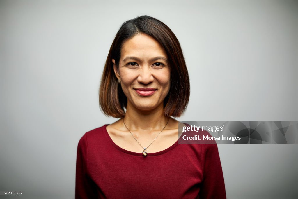 Portrait of mid adult businesswoman smiling