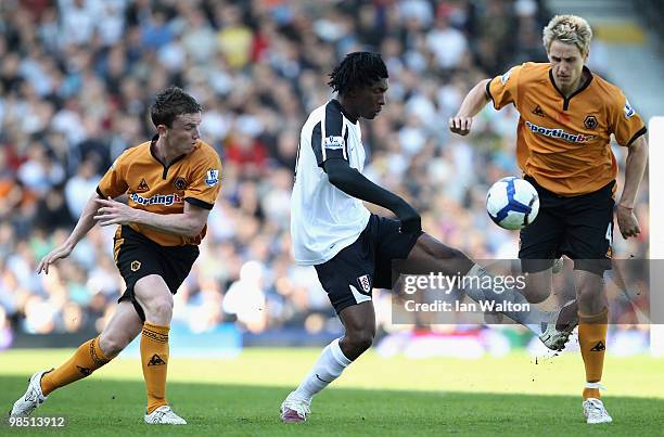 Dickson Etuhu of Fulham tackles David Edwards of Wolves during the Barclays Premier League match between Fulham and Wolverhampton Wanderers at Craven...