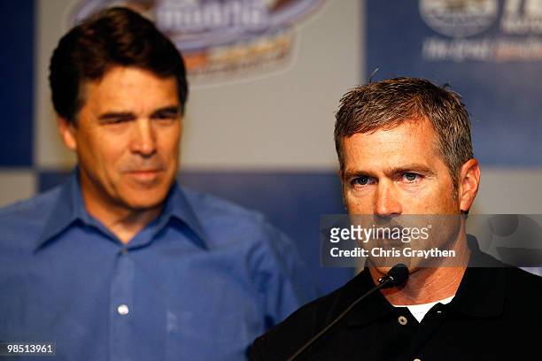 Driver Bobby Labonte speaks to the media with Texas Governor Rick Perry during a press conference at Texas Motor Speedway on April 17, 2010 in Fort...