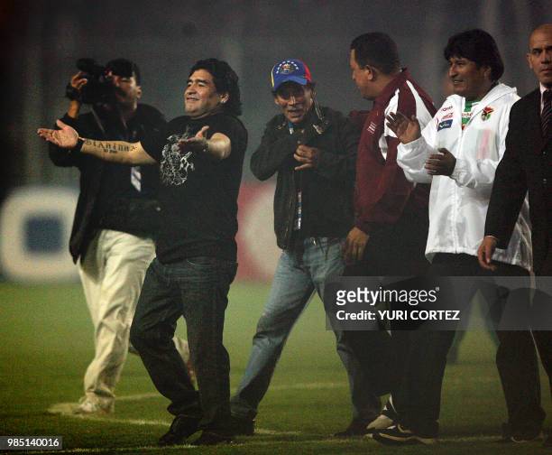 Venezuelan President Hugo Chavez , flanked by his Bolivian counterpart Evo Morales and Argentine former football star Diego Maradona walks through...