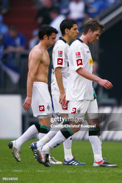 Juan Arango, Karim Matmour and Thorben Marx of Gladbach look dejected after losing 1-3 the Bundesliga match between FC Schalke 04 and Borussia...