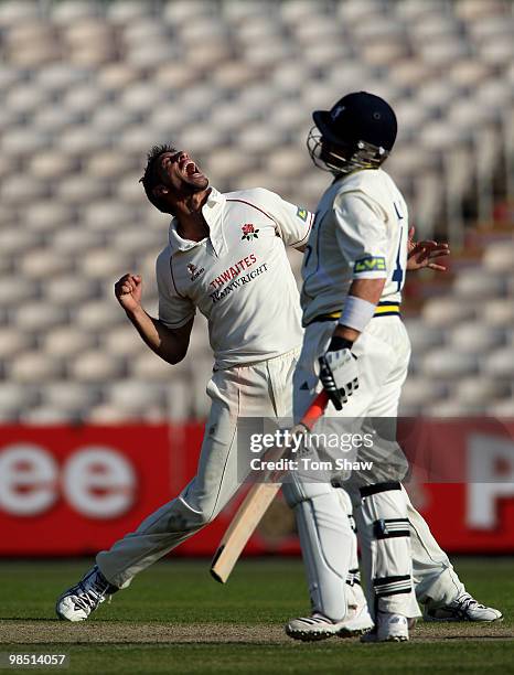 Sajid Mahmood of Lancashire celebrates after taking the wicket of Ian Bell of Warwickshire during the LV County Championship match between Lancashire...