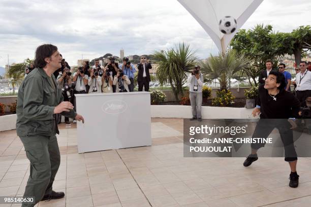 Serbian director Emir Kusturica plays with former Argentinian football player Diego Maradona during a photocall for their film 'Maradona by...