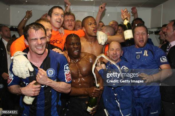 Rochdale players celebrate after gaining promotion, the club's first promotion in 41 years, at the end of the Coca Cola League Two Match between...