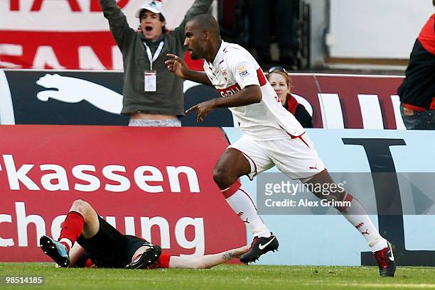 Cacau of Stuttgart celebrates his team's second goal as Michal Kadlec of Leverkusen reacts during the Bundesliga match between VfB Stuttgart and...