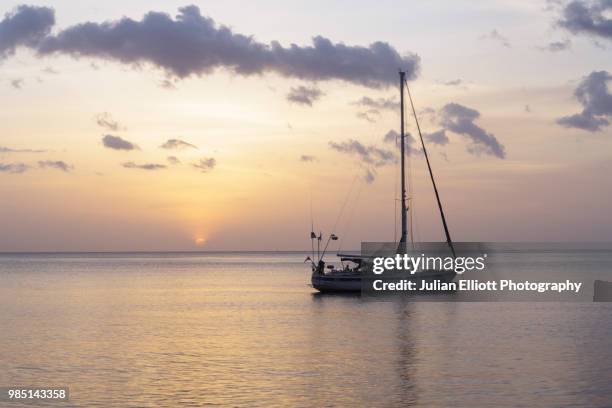 sunset at saint pierre on the island of martinique. - martinique beach stock pictures, royalty-free photos & images
