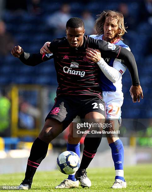 Victor Anichebe of Everton battles with Michael Salgado of Blackburn Rovers during the Barclays Premier League match between Blackburn Rovers and...