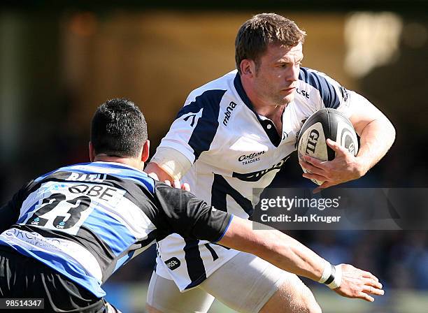 Mark Cueto of Sale hands off Shontayne Hape of Bath during the Guinness Premiership match between Bath and Sale Sharks at the Recreation Ground on...