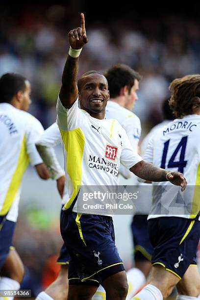 Jermain Defoe of Tottenham Hotspur celebrates scoring their first goal from the penalty spot during the Barclays Premier League match between...