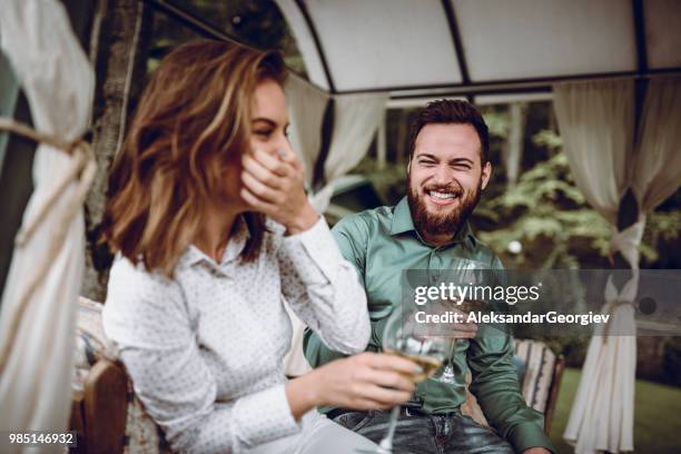 cute couple drinking champagne for anniversary celebration - drunk husband stock pictures, royalty-free photos & images