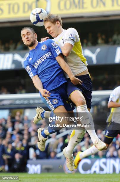 Michael Dawson of Tottenham Hotspur challenges Joe Cole of Chelsea during the Barclays Premier League match between Tottenham Hotspur and Chelsea at...