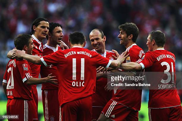 Ivica Olic of Bayern is celebrated by team mates after scoring the fourth goal during the Bundesliga match between FC Bayern Muenchen and Hannover 96...