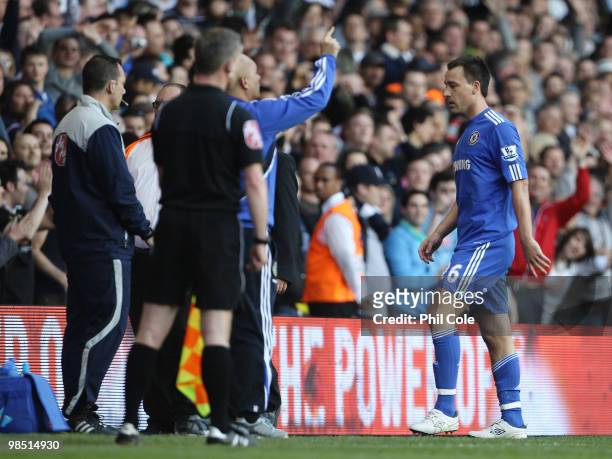 John Terry of Chelsea walks from the pitch after receiving a second yellow card during the Barclays Premier League match between Tottenham Hotspur...