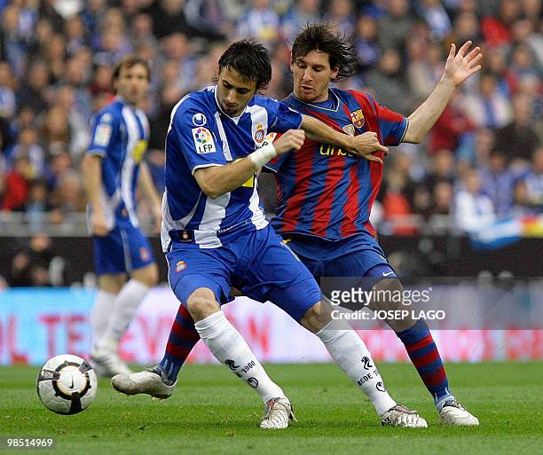 Barcelona's Argentinian forward Lionel Messi fights for the ball with Espanyol's Argentinian defender Nicolas Pareja during a Spanish League football...
