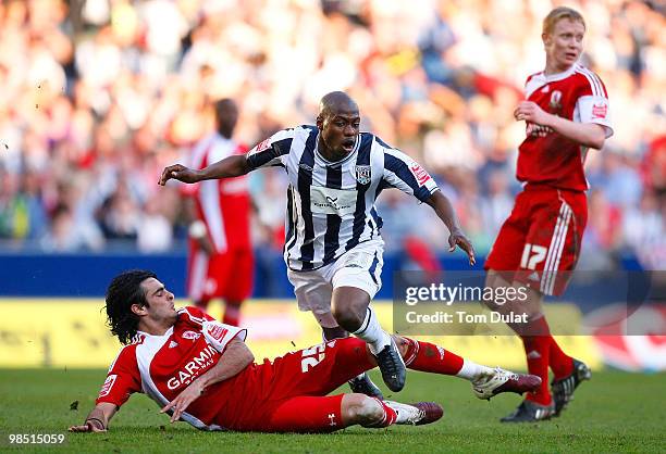Youssouf Mulumbu of West Bromwich Albion is challenged by Rhys Williams of Middlesbrough during the Coca Cola Championship match between West...