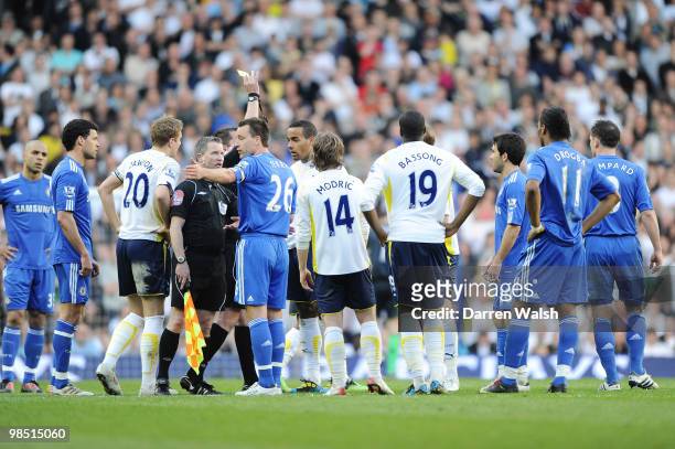 Referee Phil Dowd intervenes as players of Chelsea and Tottenham Hotspur scuffle during the Barclays Premier League match between Tottenham Hotspur...