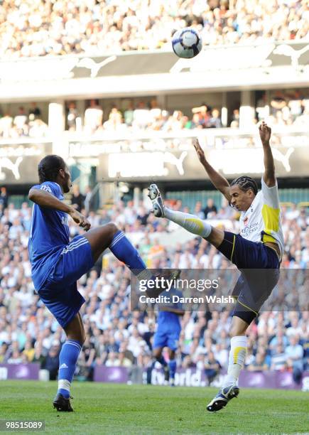 Benoit Assou-Ekotto of Tottenham Hotspur challenges Didier Drogba of Chelsea during the Barclays Premier League match between Tottenham Hotspur and...