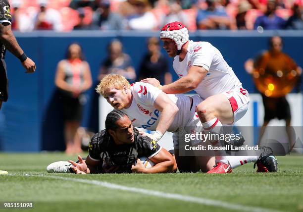 James Graham and Chris Hill of England hold down Martin Taupau of New Zealand during a Rugby League Test Match between England and the New Zealand...