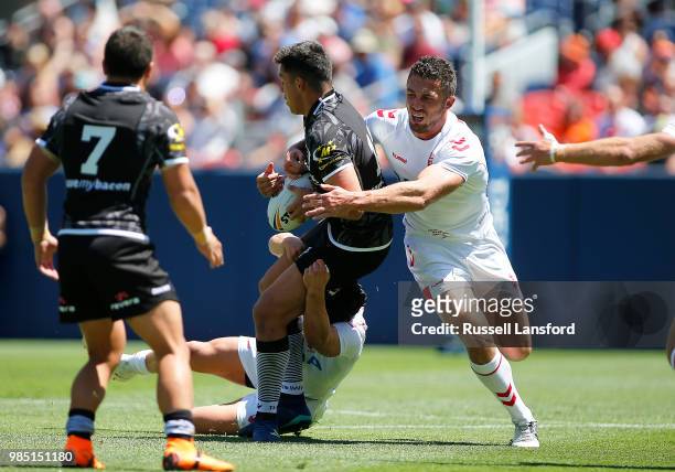 Joseph Tapine of New Zealand is tackled by Sam Burgess of England during a Rugby League Test Match between England and the New Zealand Kiwis at...