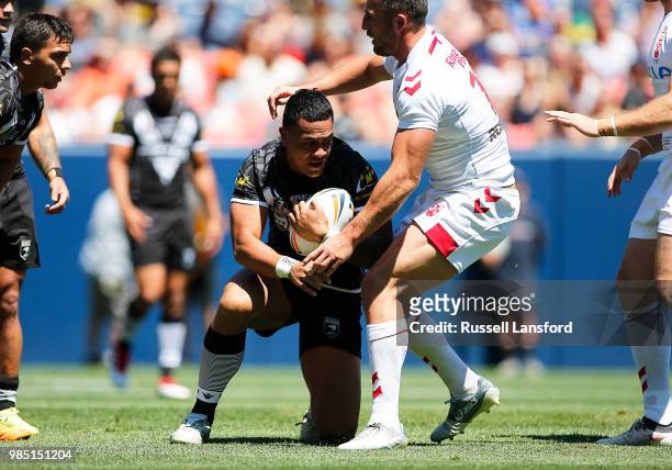 Ken Maumalo of New Zealand is stopped by Sam Burgess of England during a Rugby League Test Match between England and the New Zealand Kiwis at Sports...