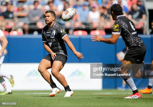 Jared Waerea-Hargreaves of New Zealand passes the ball to Te Maire Martin during a Rugby League Test Match between England and the New Zealand Kiwis...