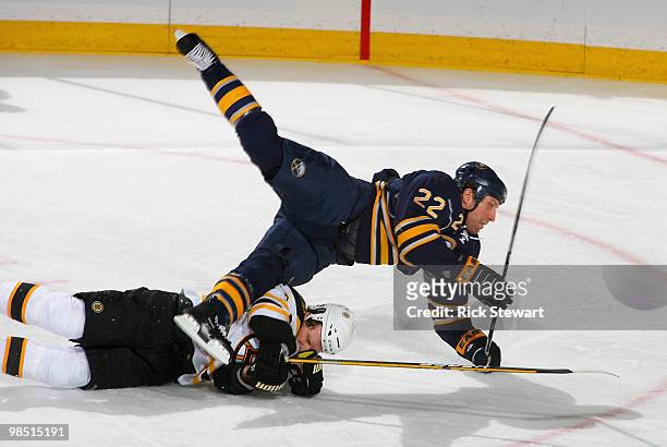 Adam Mair of the Buffalo Sabres collides and falls over Dennis Wideman of the Boston Bruins in Game Two of the Eastern Conference Quarterfinals...