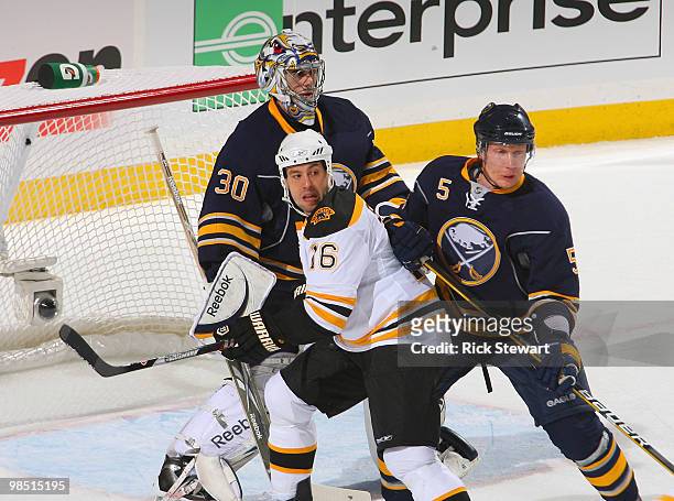 Ryan Miller and Toni Lydman of the Buffalo Sabres defend against Marco Sturm of the Boston Bruins in Game Two of the Eastern Conference Quarterfinals...