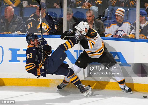 Tyler Ennis of the Buffalo Sabres is checked off his feet by Steve Begin of the Boston Bruins in Game Two of the Eastern Conference Quarterfinals...