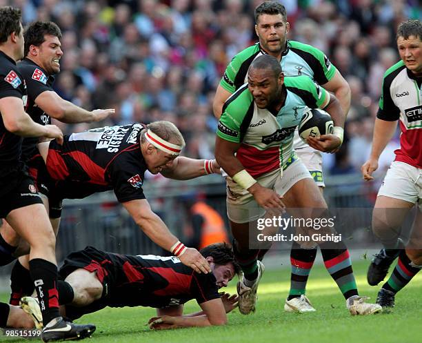 Jordan Turner-Hall of Harlequins avoids the tackles during the Guinness Premiership game between Saracens and Harlequins at Wembley Stadium on April...