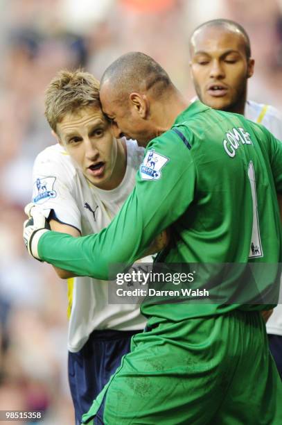 Heurelho Gomes of Tottenham Hotspur hugs Michael Dawson after his last ditch tackle during the Barclays Premier League match between Tottenham...