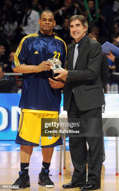 President of Euroleague Jordi Bertomeu presents an award to Immanuel McElroy of Alba Berlin during the Best Season Players Award Ceremony at Fernando...